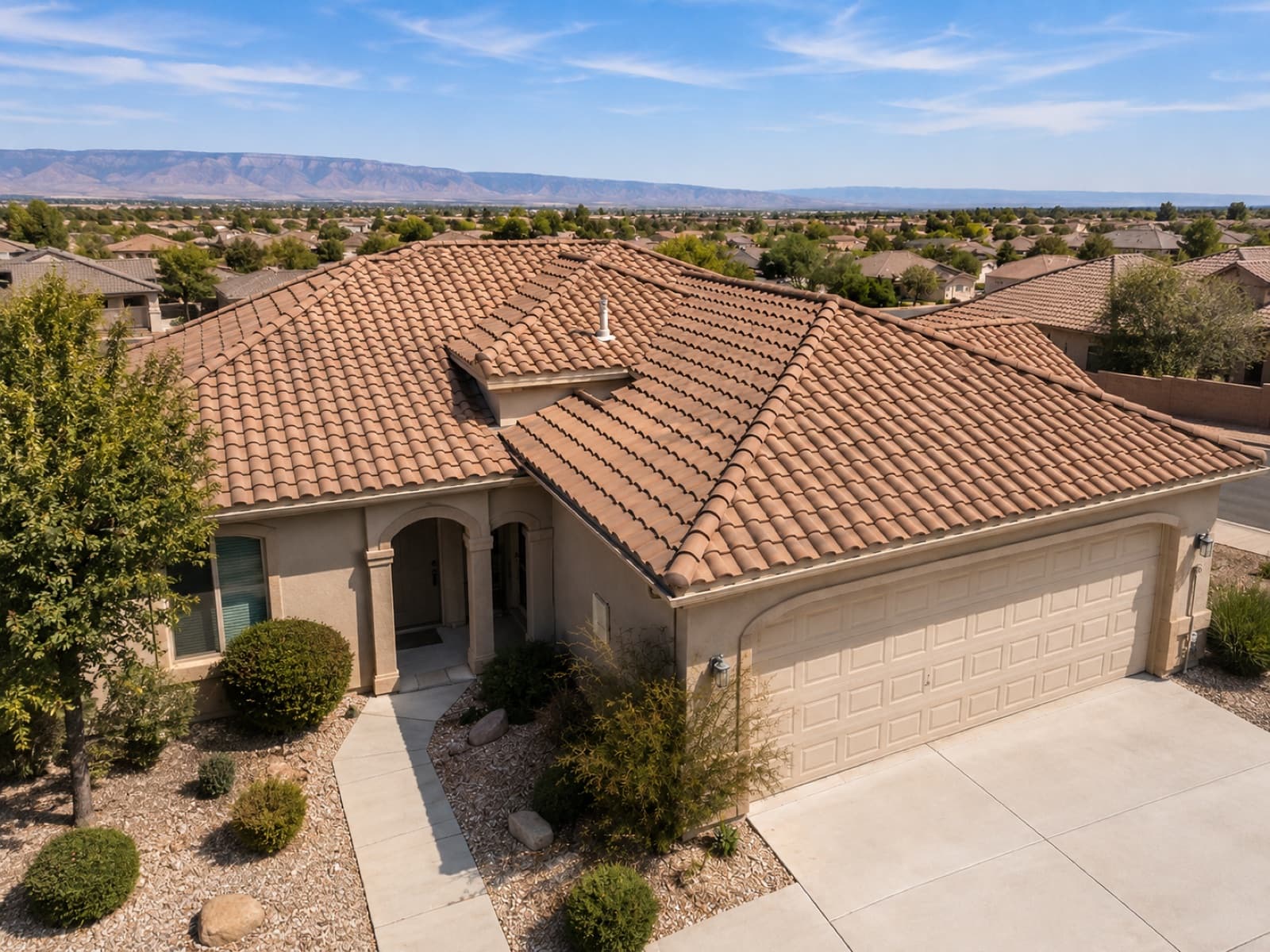 Completed tile roof on a Southern Utah home overlooking the desert valley and distant mountains