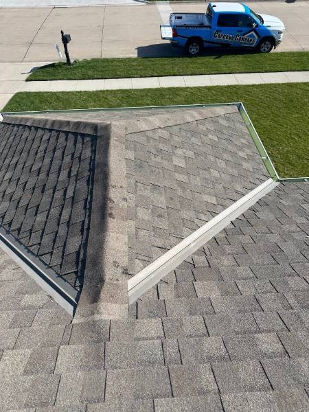 Aging asphalt shingle roof on a Cedar City home with curling and granule loss