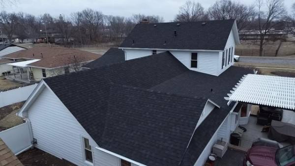 Aged asphalt shingle roof in southern Utah showing UV wear and granule loss