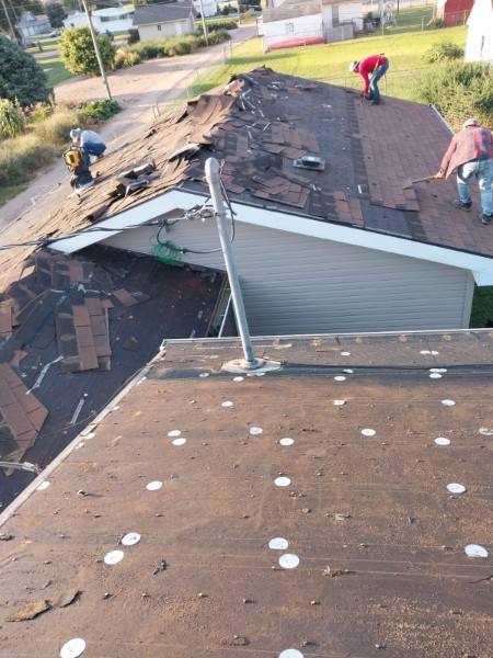 Residential roof in Beaver, Utah with the Tushar Mountains in the background